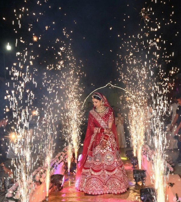 Bride in beautiful dress sitting resting on sofa indoors