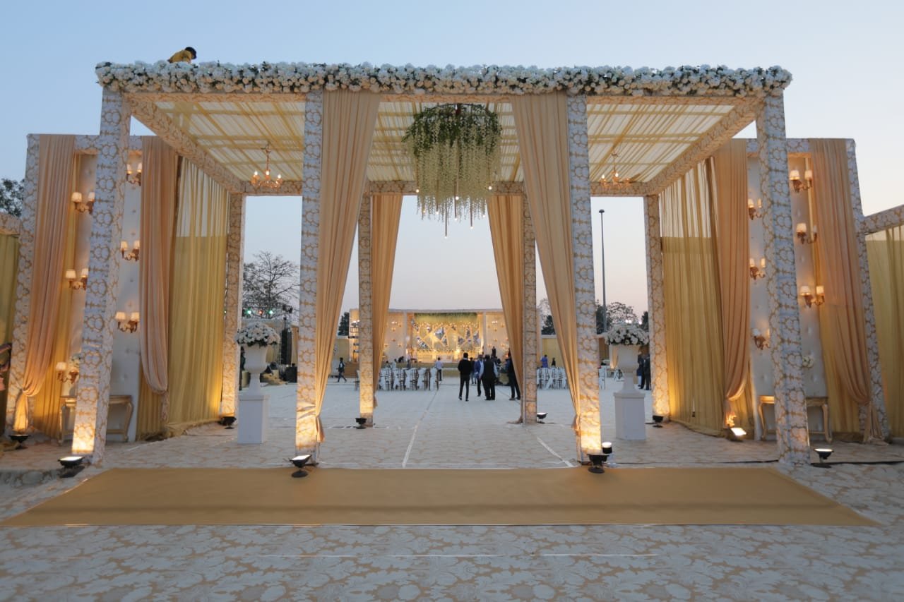 Couple sitting together on grass during a picnic